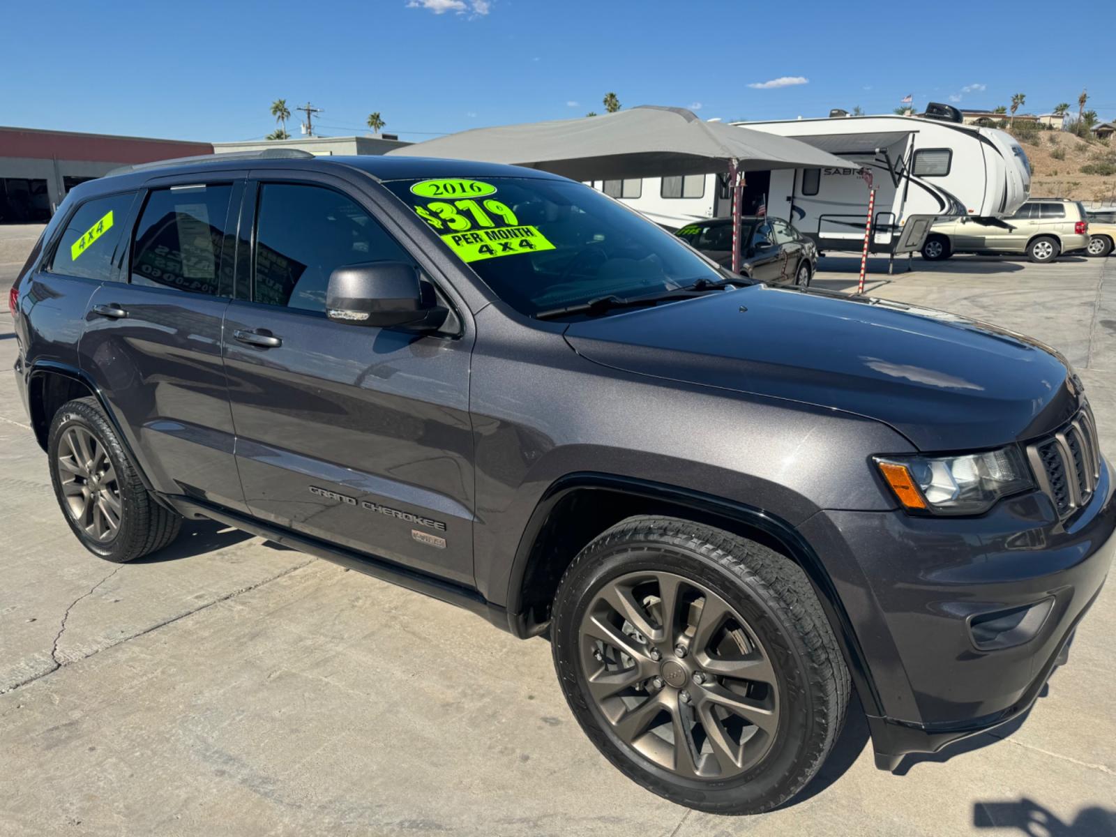 2016 grey Jeep Grand Cherokee (1C4RJFBG0GC) , located at 2190 Hwy 95, Bullhead City, AZ, 86442, (928) 704-0060, 0.000000, 0.000000 - 75th anniversary edition. clean carfax. jeep grand cherokee limited 4 wd. Leather loaded. 81k miles. free and clear title. - Photo #1